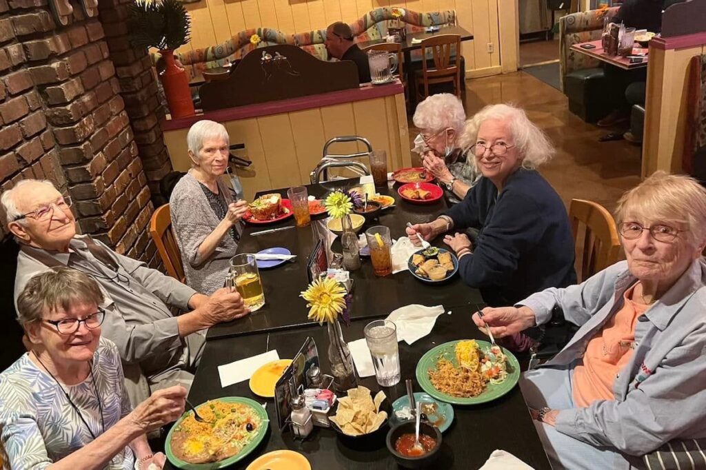 Broadway Mesa Village | Seniors friends having lunch at a restaurant