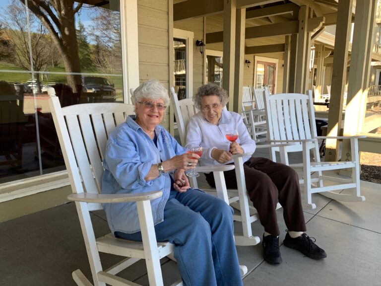 The Village at Rancho Solano | Residents sitting on porch