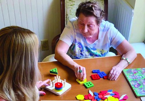 Sun City West | Memory care resident solving puzzle