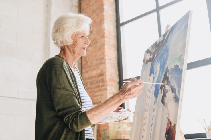 The Courtyards at Mountain View | Senior woman painting
