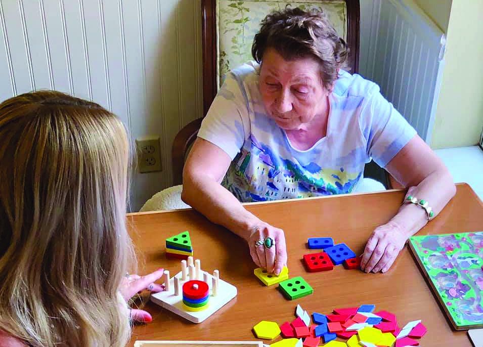 Sun City West | Memory care resident solving puzzle